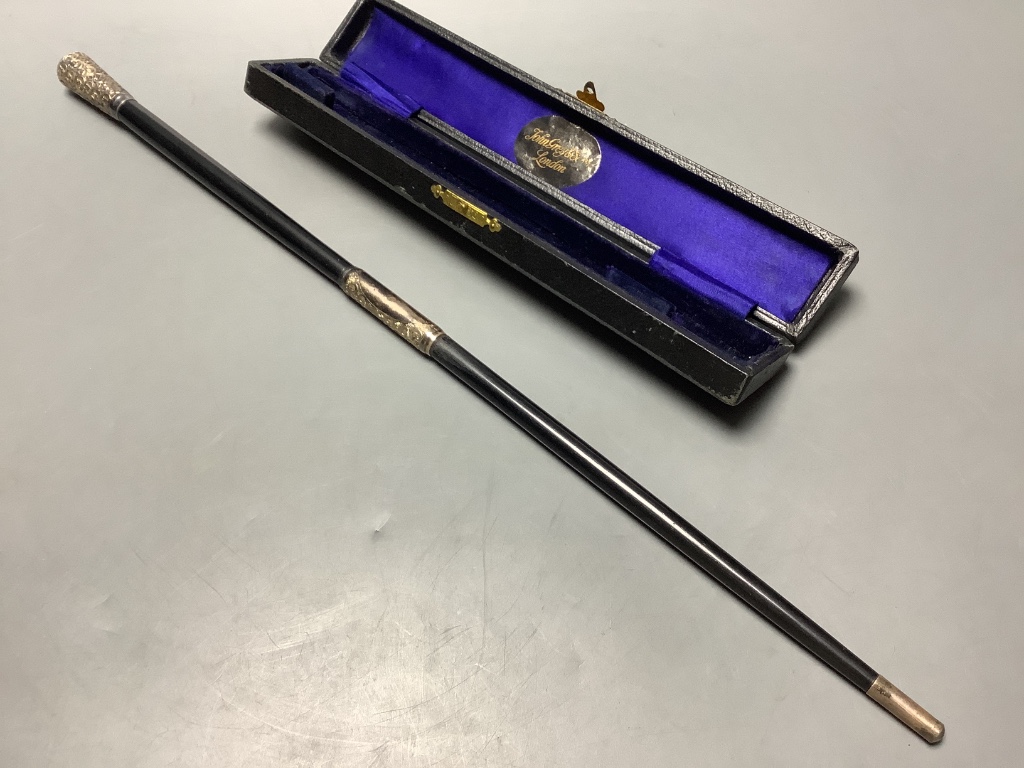 A George V silver mounted ebonised conductors baton in case, 45.3 cm.